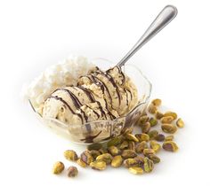 a bowl filled with ice cream and nuts