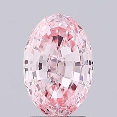 an oval pink diamond on a stand