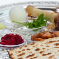 a silver plate topped with different types of food