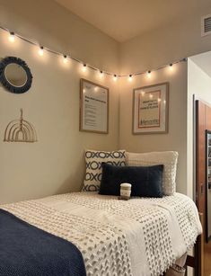 a bedroom with lights strung above the bed