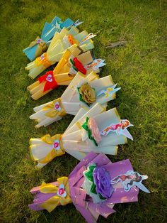 paper flowers laid out on the grass