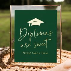 there is a sign that says diplomas are sweet please take a treat on it