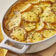 a casserole dish with potatoes and herbs