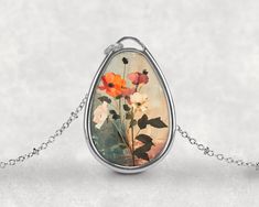 Step into a world of blooming beauty with the Blossom Enchantment Pendant. This exquisite necklace captures the essence of a magical garden, where flowers and fairies dance together in harmony. Inspired by the delicate beauty of botanical gardens and the whimsical charm of fairy tales, this pendant is perfect for those who appreciate the elegance of nature and the nostalgia of cottagecore. The pendant showcases a beautifully detailed flower surrounded by botanical elements, all set within a vint Necklace Fairy, Fairies Dancing, Botanical Elements, Fairy Necklace, Necklace Flower, Magical Garden, Delicate Beauty, Aluminum Prints, Flower Lover