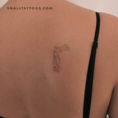 a woman with a tattoo on her back