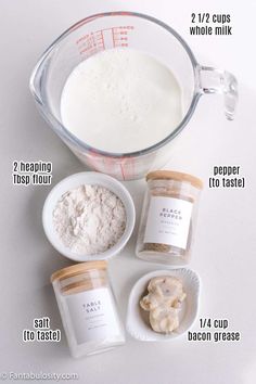 ingredients needed to make an ice cream smoothie in a measuring cup on a white surface