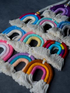 there are many different colored rings on the floor with tassels attached to them