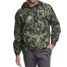 Champion Lightweight Windbreaker - Camo Green. Features: Wind Resistant, Water Resistant Closure Type: Zipper Pockets: 1 Front Kangaroo Pocket Sleeve Length: Long Sleeve Warmth Factor: Lightweight Outerwear Length: Short Fabric Content: 100% Polyester Fabric Description: Woven Coat Style: Windbreakers Care: Machine Wash Country Of Origin: Imported Military Style Windbreaker For Spring Outdoor Activities, Spring Military Style Windbreaker For Outdoor Activities, Spring Military Windbreaker For Outdoor Activities, Casual Camouflage Windbreaker For Outdoor Activities, Casual Camouflage Outerwear For Outdoor Activities, Casual Camouflage Outerwear For Sports, Cute Raincoats, Green Windbreaker, Half Zip Windbreaker