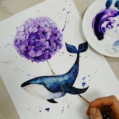 someone is painting a whale with purple flowers