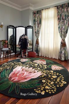 a large rug is in the middle of a room with mirrors and curtains on the wall