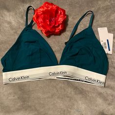 Beautiful Yet Sexy Calvin Klein Lightly Lined Bralette Bra With A Sleek Design And Iconic Logo Branding, This Lightly Lined Bralette Is A Modern Classic That Offers Moderate Coverage, Adjustable Straps. Brand Logo Design On Under-Band, Lightly Lined Wireless Triangle Cups. Cushioned 2 Row Hook & Eye Back Closure. Color - Green, Size - M, Xl *** New Wt *** Stretch Padded Cup Bra For Loungewear, Stretch Bra With Padded Cups For Loungewear, Padded Cups Bra For Loungewear, Stretch Padded Bra For Loungewear, Green Triangle Top With Padded Cups, Fitted Padded Bra For Loungewear, Fitted Seamless Calvin Klein Bra, Calvin Klein Fitted Seamless Bra, Calvin Klein Seamless Fitted Bra