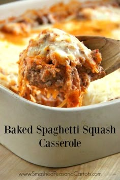 baked spaghetti squash casserole in a white dish with a wooden spoon