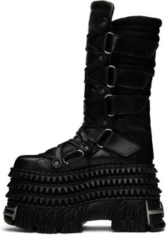 Calf-high buffed leather boots in black. · Graphic rivets throughout · Graphic hardware at toe, heel, and sole · Cinch velcro closure at sides · Padded tongue · Quilted jersey collar · Buffed leather lining · Studded platform rubber midsole · Treaded rubber sole · Platform: H4.5 · Heel: H5 Part of the VETEMENTS X New Rock collaboration. Supplier color: Black Leather Platform Boots With Studded Outsoles For Streetwear, Alternative Leather Platform Boots With Spikes, Leather Platform Boots With Spikes In Alternative Style, Leather Platform Boots With Spikes For Concert, Spiked Leather Platform Boots For Concerts, Edgy Platform Boots With Rubber Sole, High-top Leather Platform Boots With Rivets, Leather Platform Boots With Studded Outsoles For Concert, Leather High-top Platform Boots For Concert