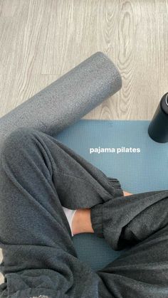 a person laying on top of a yoga mat