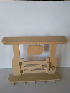 a model of a bench made out of plywood and wood with pegs on the legs