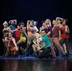 a group of people standing on top of a stage