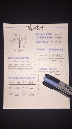 a pen sitting on top of a piece of paper next to a calculator