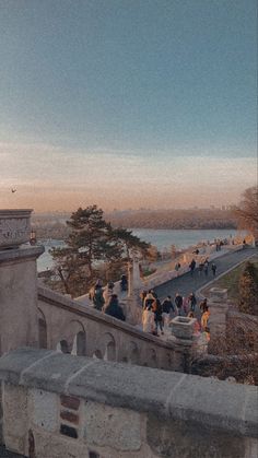 people are standing on the top of a building