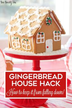 a gingerbread house is sitting on top of a red cake plate with the words how to keep it from falling down