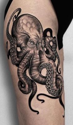 an octopus tattoo is shown on the thigh, with black and white ink in it