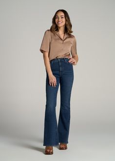 Timeless Flair in Women's Tall High Waisted Jeans We're Bringing Retro Back Introducing the Chloe High Rise Flare Tall Women's Jeans - a denim fave that combines timeless style with the perfect fit for taller figures. These tall high waisted jeans feature a flattering dramatic flare leg, crafted to elongate and enhance your silhouette. The pre-washed fabric ensures a comfortable fit from day one, while the classic 5-pocket design adds a touch of traditional denim charm. Step into our Chloe jeans Jeans For Tall Women, Scrubs Dress, Cozy Sleepwear, Soft Dramatic, High Rise Flare Jeans, Dark Indigo, Sports Blazer, Women Essentials, Long Sleeve Tee Shirts