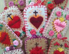 several handmade cell phones with flowers and hearts on them are arranged in a circle