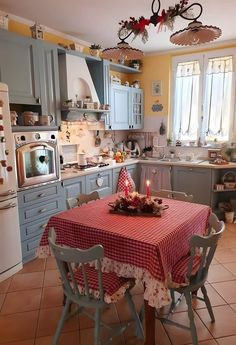 a kitchen with a table and chairs in it