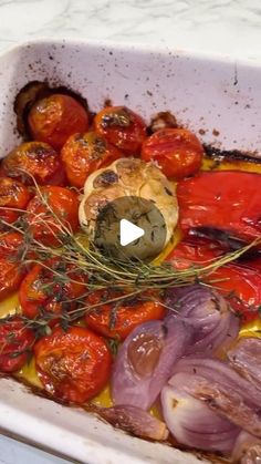 tomatoes, onions and other vegetables in a baking dish