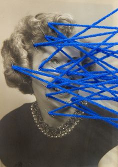 an old photo with blue string attached to the woman's face and hands behind her