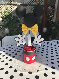 a mickey mouse centerpiece is sitting on a table