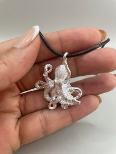 Octopus pendant. Jewelry for lovers of the ocean and sea life. A perfect fathers day gift. This is an unique work done all by the sea passionate and artist, design, production, and finish. This pendant is included with a black waxed cord necklace(18in.) **Note: Pictures are enlarged to show detail. All pendants are packaged and shipped in a cotton baggy inside a water and tear resistant bubble wrap envelope. If you have any questions about this item or any other items listed in our shop please d Ocean-inspired Silver Pendant Jewelry, Silver Ocean-inspired Pendant Jewelry, Octopus Necklace, Octopus Pendant, Note Pictures, Cord Necklace, For Lovers, Bubble Wrap, By The Sea