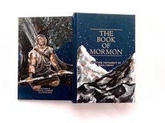 the book of mormon is on display in front of a white background with mountains and trees