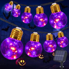 purple and gold halloween light bulbs with pumpkins on them