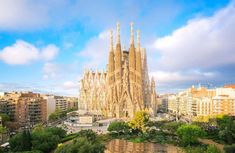 the famous cathedral in barcelona, spain is seen from across the city's river