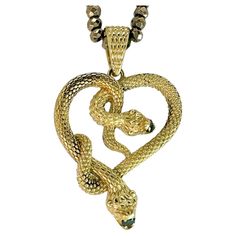 This is the second time we've cast this pendant -- an original design by Eytan Brandes. It depicts two amorous snakes slithering together to form a heart while they chomp happily on bright green diamonds. The diamonds are 2.5mm and 2.7mm full-cut earth-mined stones with a total weight of 0.14 carats. Topped with a matching scaly triangular bale big enough to handle most of your chain hardware. We made the pyrite necklace specifically for this pendant and we think the two look great together: it Luxury Snake-shaped Jewelry For Anniversary, Snake-shaped Yellow Gold Jewelry For Anniversary, Snake Shape Yellow Gold Jewelry For Anniversary, Unique Snake-shaped Jewelry For Anniversary, Unique Snake Shaped Jewelry For Anniversary, Anniversary Yellow Gold Snake-shaped Jewelry, Antique Gold Snake-shaped Jewelry, Luxury Snake-shaped Jewelry Gift, Luxury Snake-shaped Jewelry For Gifts