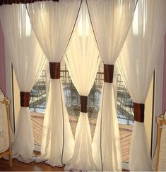 the curtains are hanging in front of the window