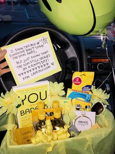 a car filled with lots of items and a note attached to the dash board that says, you are here