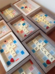 several scrabble tiles are arranged on the floor