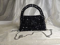 Handmade Crystal Black Beaded Mini Bag with Silver-Toned Hardware This elegant handbag, crafted from crystal black glass pink beads, features silver-toned hardware and a 47-inch removable chain. The magnetic closure adds convenience and ease of use. Our bags are 100% handmade. Each bag is unique and crafted with love for our customers. It takes 3-5 days to create one bag. A perfect gift for women, friend, family member or loved one. Ideal for any celebration, event, wedding or birthday party. Th Black Evening Bags With Bling, Elegant Handbag, Graduation Photography Poses, Crystal Bags, Graduation Photography, Pink Beads, One Bag, Beaded Jewelry Diy, Jewelry Diy