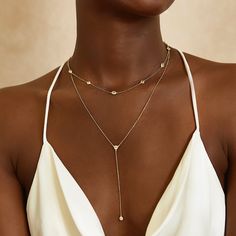 This dainty Y-Lariat necklace hangs on a delicate, diamond-cut cable chain from our signature O Collection. Pair it with other necklaces from this collection. Our patented connectors let you easily link and layer necklaces in any order you desire. Drop Height 3.5in (8.9cm) Adjustable chain: 15-17in (38-43cm) When layered, chain length is: 15-21in (38-53cm) Learn more Gold Vermeil Spring clasp closure Hypoallergenic, lead and nickel free #321G Cheap Gold Drop Necklace For Party, Affordable Formal Necklace With Adjustable Chain, Luxury Long Drop Backdrop Necklace As Gift, Cheap Modern Necklaces For Formal Occasions, Cheap Adjustable Choker Lariat Necklace, Jewelry For V Neck Dress V Neck, Luxury Minimalist Herringbone Necklace For Formal Occasions, Cheap Chic Lariat Necklace, Cheap Long Party Necklaces