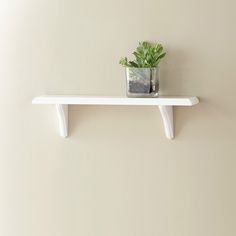 Creating decorative storage space can be fun with this white decorative Bracketed shelf. A white shelf will match the colors of any room. Buy two or three and hang together to create a decorative display of coordinating accessories, while at the same time create storage space. This shelf is perfect for displaying toys or stuffed animals in a kid's room, or for storing laundry, bathroom, or kitchen supplies. Style Selections 18-in L x 5-in D x 4.85-in H White Rectangular Bracket Shelf | 9481162 Long Wall Shelves, Wall Mounted Shelving, Laminate Wall, White Shelf, Bracket Shelf, Decorative Shelf, Shelving Accessories, Long Walls, White Shelves