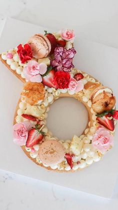 a doughnut decorated with flowers and shells