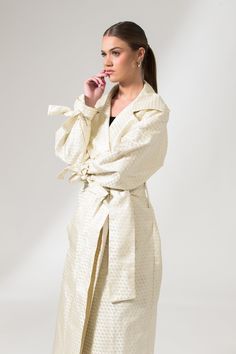 The Mae Trench Coat is a reinvented bold twist on the classic Mary Trench Coat. Crafted from pure jacquard silk, it is a double-breasted coat that comes in a relaxed fit with wide lapels, collar, and sleeves. It's elevated through its minimal interwoven matte-finished chequered pattern, fluid shape, and French seams. This sustainable trench coat is tailor made and on demand and takes us 10 hours to make it. PLEASE ALLOW 1-5 BUSINESS DAYS FOR PRODUCTION Spring Formal Jacquard Outerwear, Formal Spring Jacquard Outerwear, Luxury Cream Outerwear For Spring, Chic Silk Outerwear With Hidden Button Closure, Chic Silk Outerwear For Daywear, Elegant Cream Outerwear For Daywear, Chic Silk Double-breasted Outerwear, Luxury Silk Outerwear For Spring, Chic Fall Jacquard Outerwear