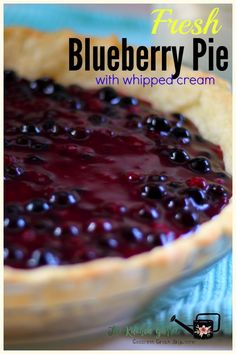 fresh blueberry pie with whipped cream is ready to be eaten for breakfast or dessert