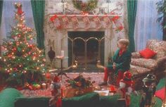 an older woman sitting in front of a christmas tree