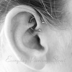 an ear piercing is seen in this black and white photo with the word piercings are fab