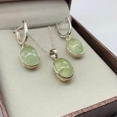 This Jewelry set comes with a 100% Natural Prehnite by Gemstone, and it is made up of 925 solid sterling silver. This Jewelry set is handcrafted by our skilled craftsmen and designed by us. Every gemstone is handpicked for the best quality. Material :- Silver (925 Solid Sterling Silver) Gemstone :- Natural Prehnite  All Item Weight :- 11.00 Garam Approx. Stone Shape :- Oval Cabochon Gemstone Size :- 10x14 MM Payment Policy :- We accept payment through PayPal. All payments must be made within 7 d Handmade Light Green Jewelry Gift, Green Gemstones With Polished Finish For Gift, Green Polished Gemstones For Gift, Polished Green Gemstones For Gifts, Sage Green Outfit, Sage Jewelry, Green Pendant, Bridal Jewelry Set, Green Pendants