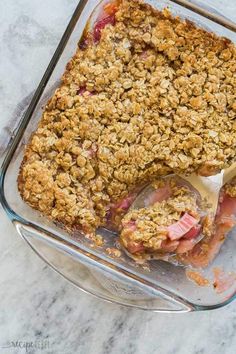 a casserole dish filled with fruit and crumbs