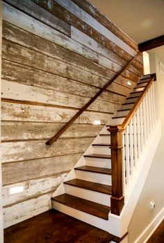 the stairs are made from wood and have white railings