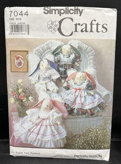 the front cover of a book with two stuffed animals in dresses and bonnets on it